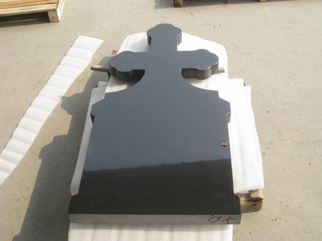 Black cross tombstone